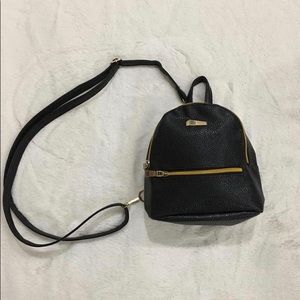 BRAND NEW Black cross body backpack